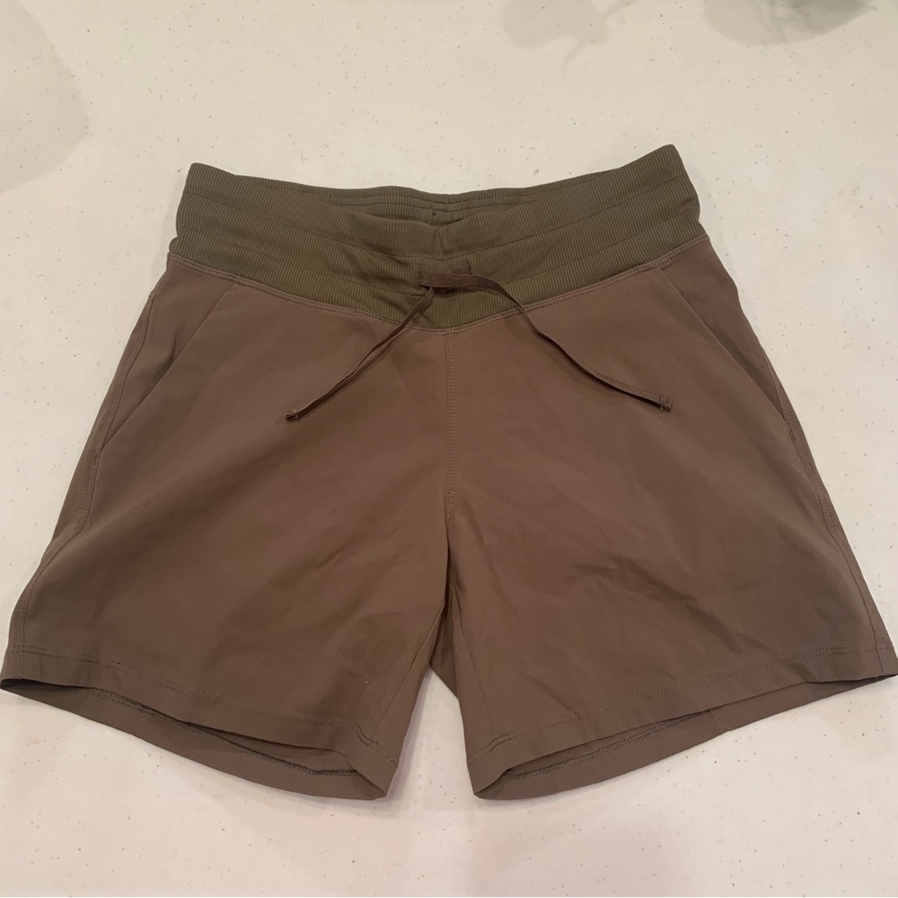 Tuff Athletics. Small brown shorts with pockets and drawstrings.